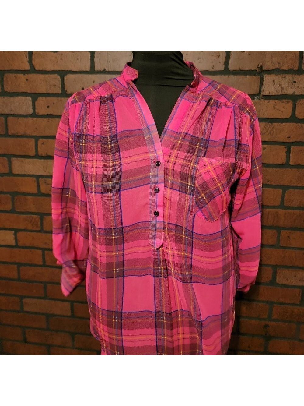 Coolwear Size L. 3/4 sleeve  with button tabs.  Bright pink plaid design.  Sheer